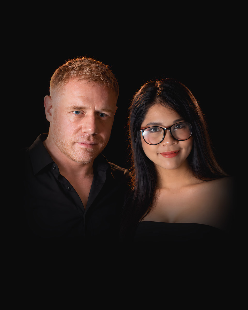 Tim and Paemi, the founders of TimPaemi, side by side in black