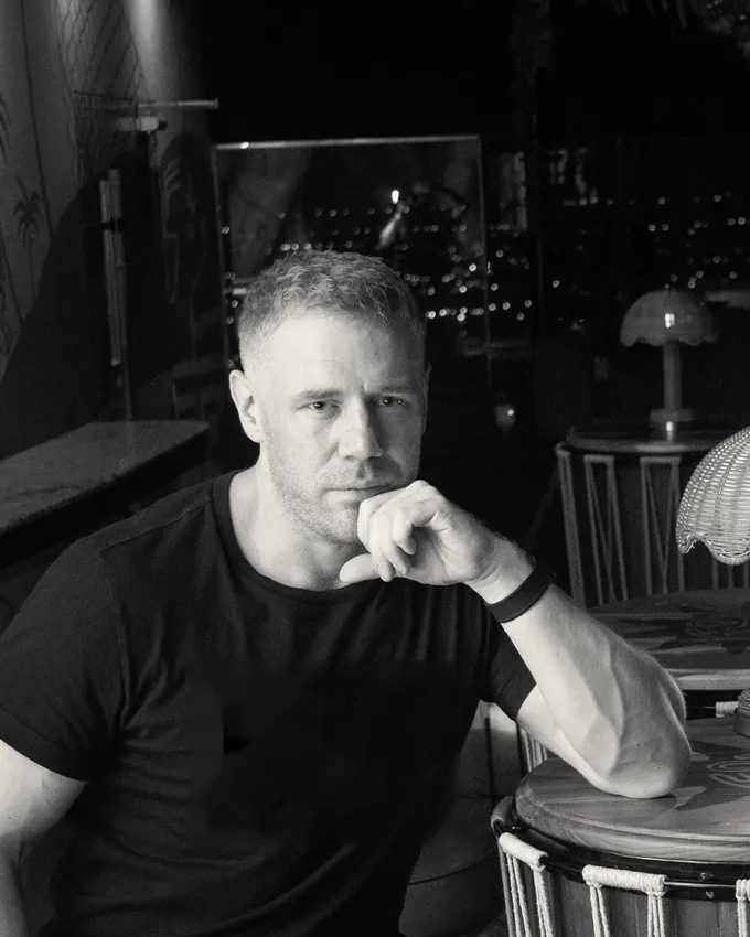 Tim, co-founder of TimPaemi, at a table in a lounge in Pattaya